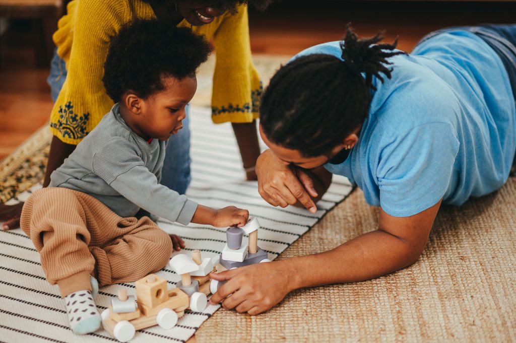 A happy family playing and supporting child's aba therapy journey.