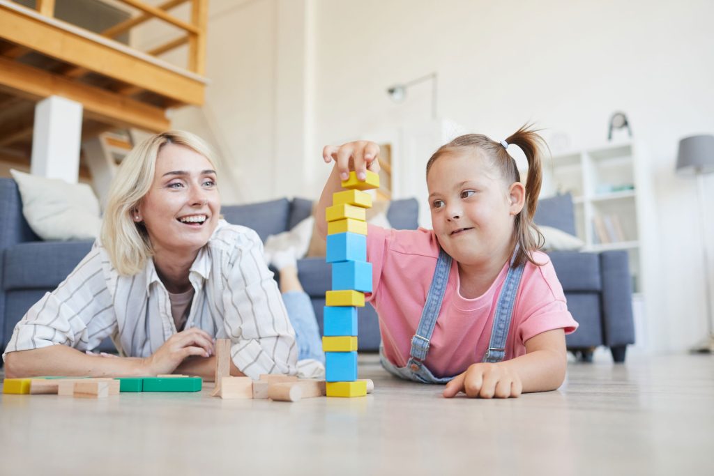 Mother playing with her daughter.