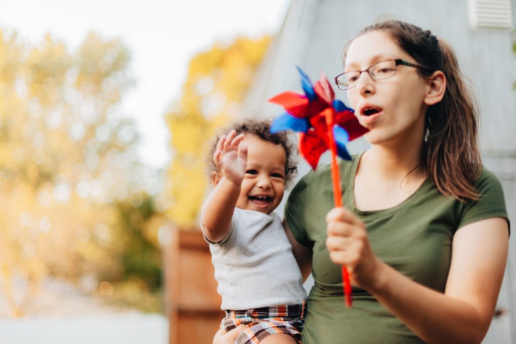 Mother and son having fun in the backyard.