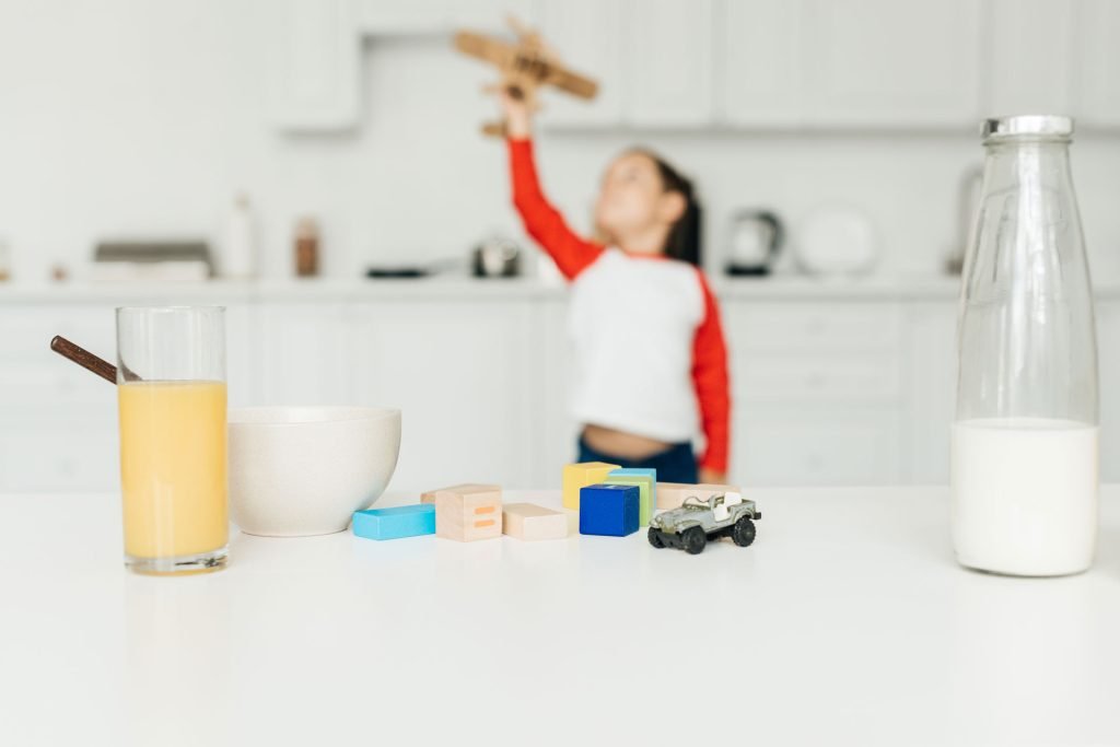 Boy playing with his airplane toy.