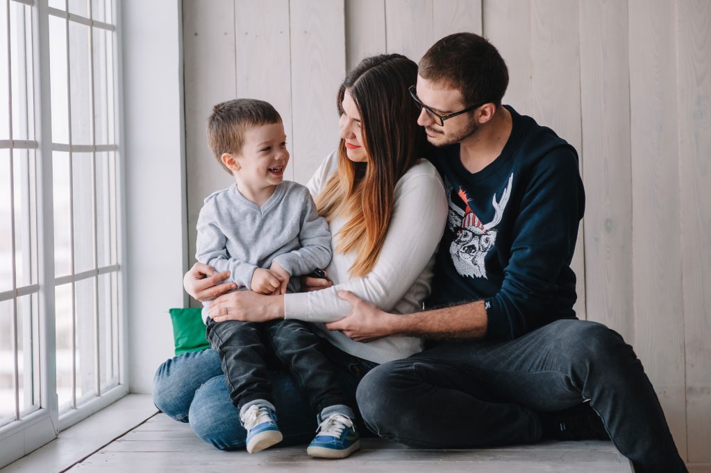 Family sitting in a room.