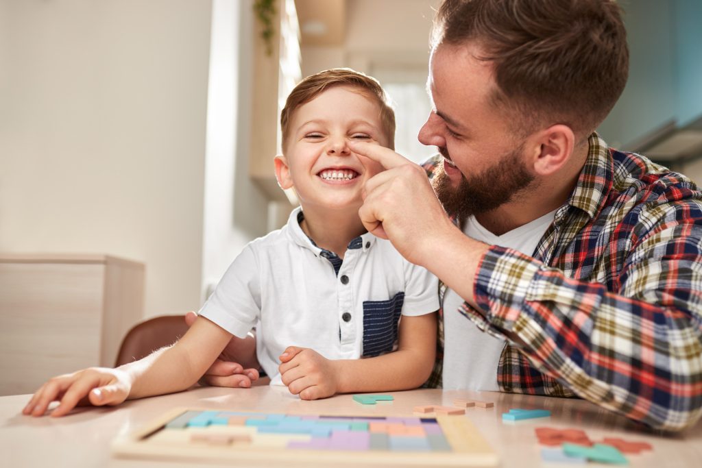 Father and son playing together.
