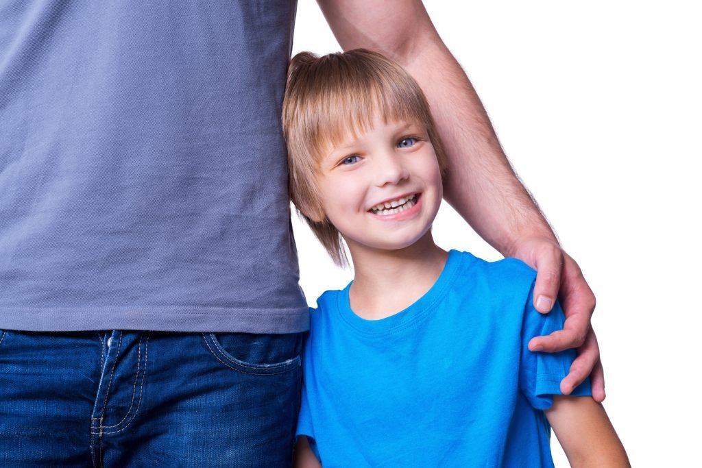 Smiling boy with father.