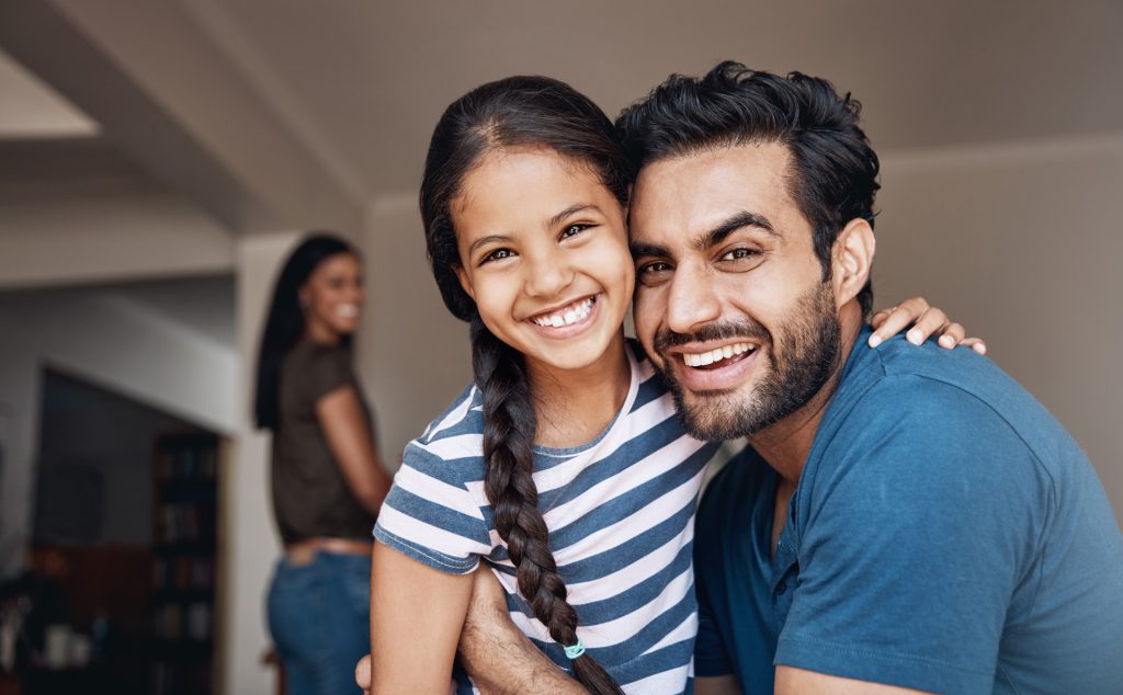 Smiling girl with father.